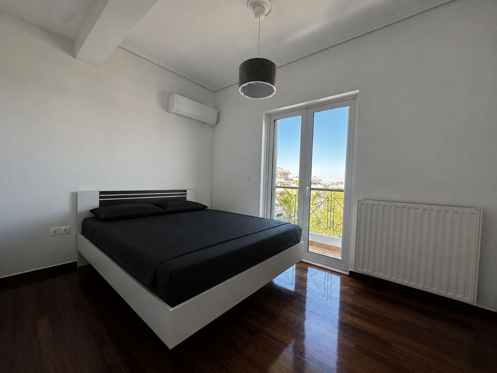 Main bedroom with doors to the balcony